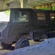 Illustration for article titled This Abandoned Soviet Sub Base Is Hiding Amazing Army Truck Barn Finds